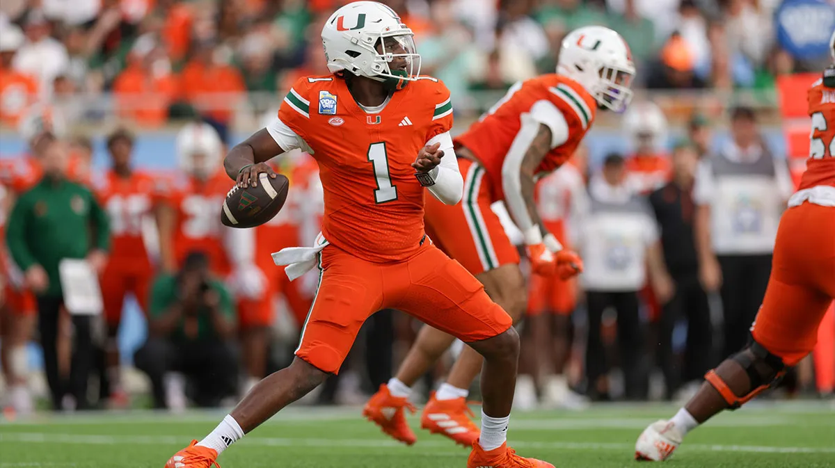 University of Miami Hurrican Cam Ward drops back to pass against the Cyclones wearing full orange
