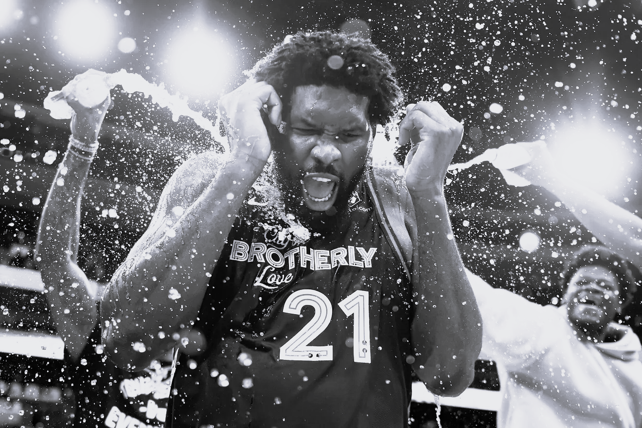 Joel Embiid celebrating but in black and white symbolizing that we are now celebrating something bad