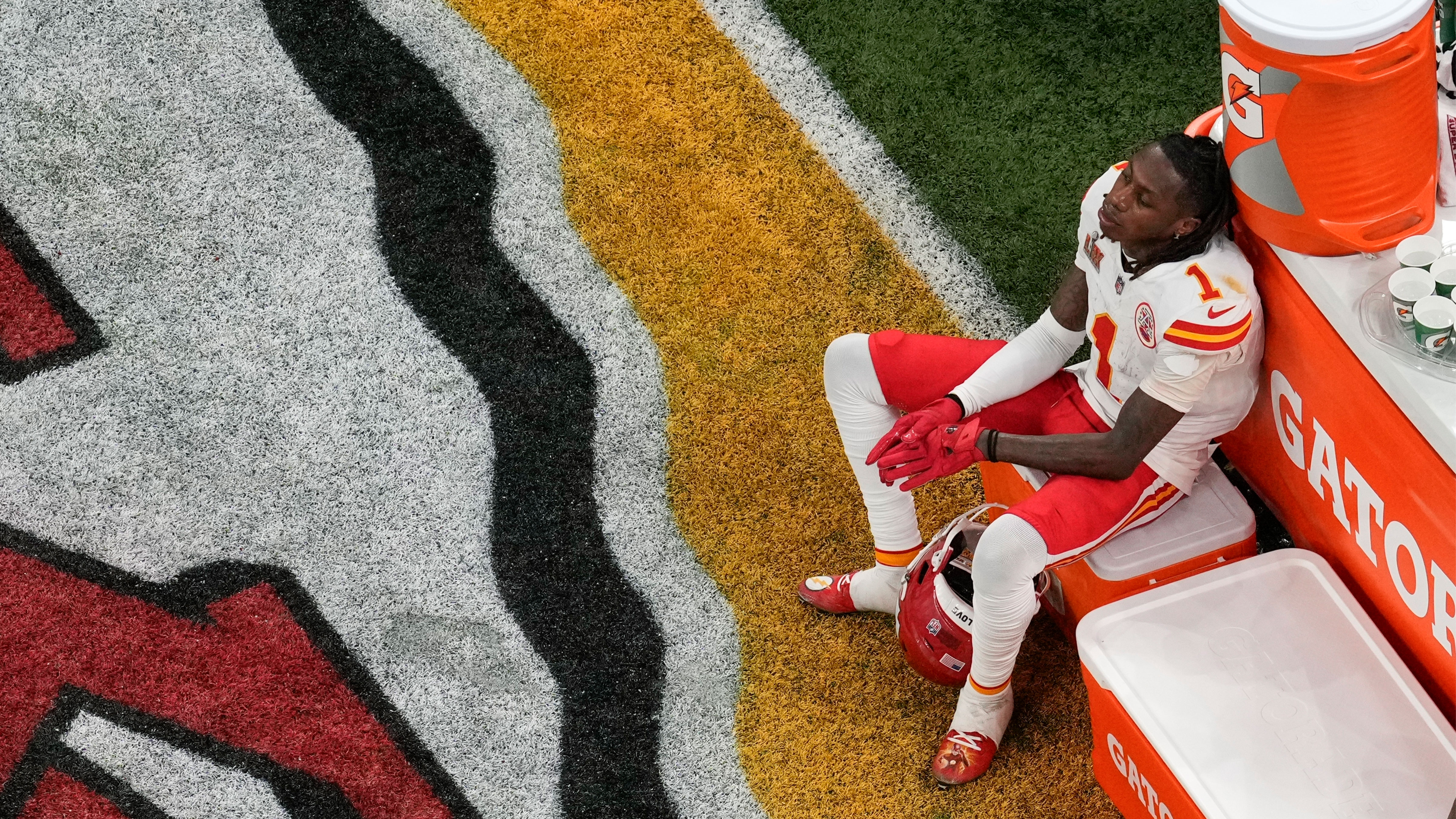 Kansas City Chiefs wide receiver Xavier Worthy (1) sits on a cooler during the second half of Super Bowl LIX against the Philadelphia Eagles, Sunday, Feb. 9, 2025, in New Orleans.