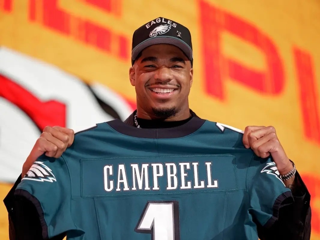 Jihaad Campbell showing off his new Eagles jersey after getting selected by the Super Bowl Champs