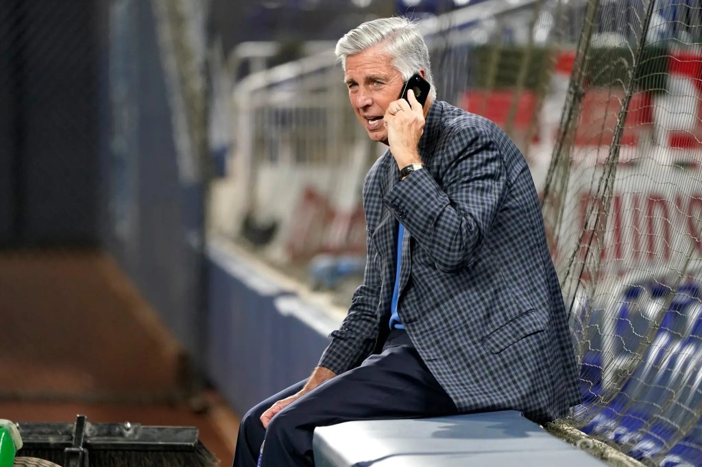 Dave Dombrowski of the Phillies on the phone at the 2022 World Series