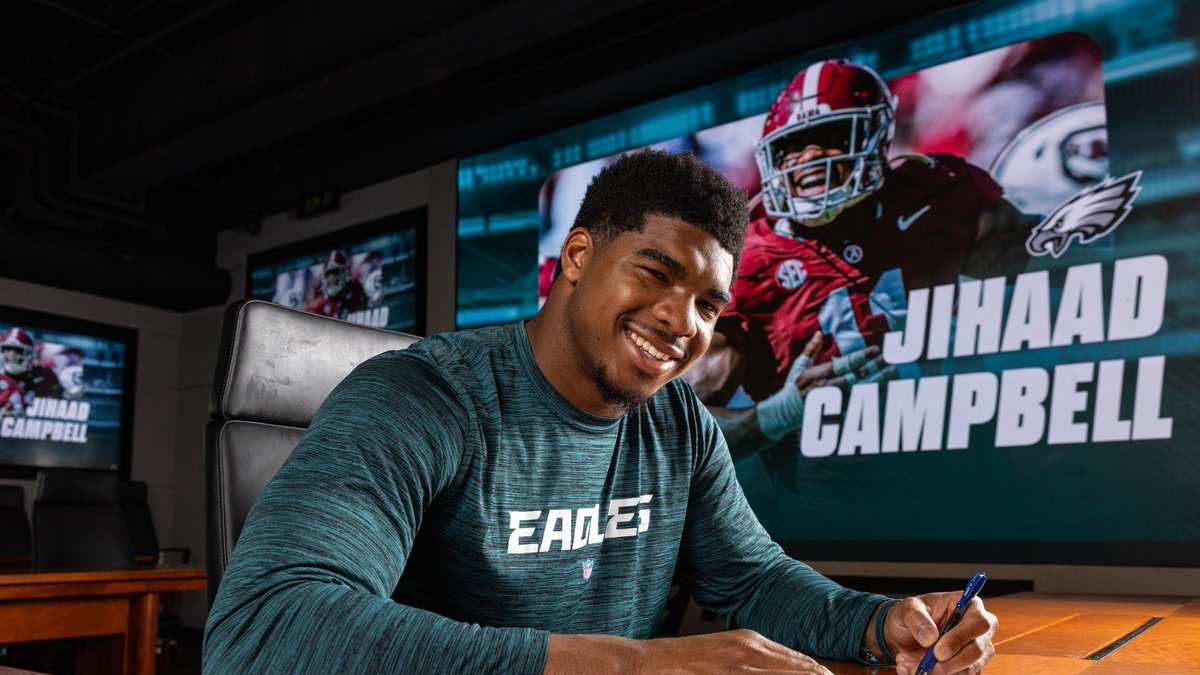 Jihaad Campbell signing his NFL contract with the Eagles