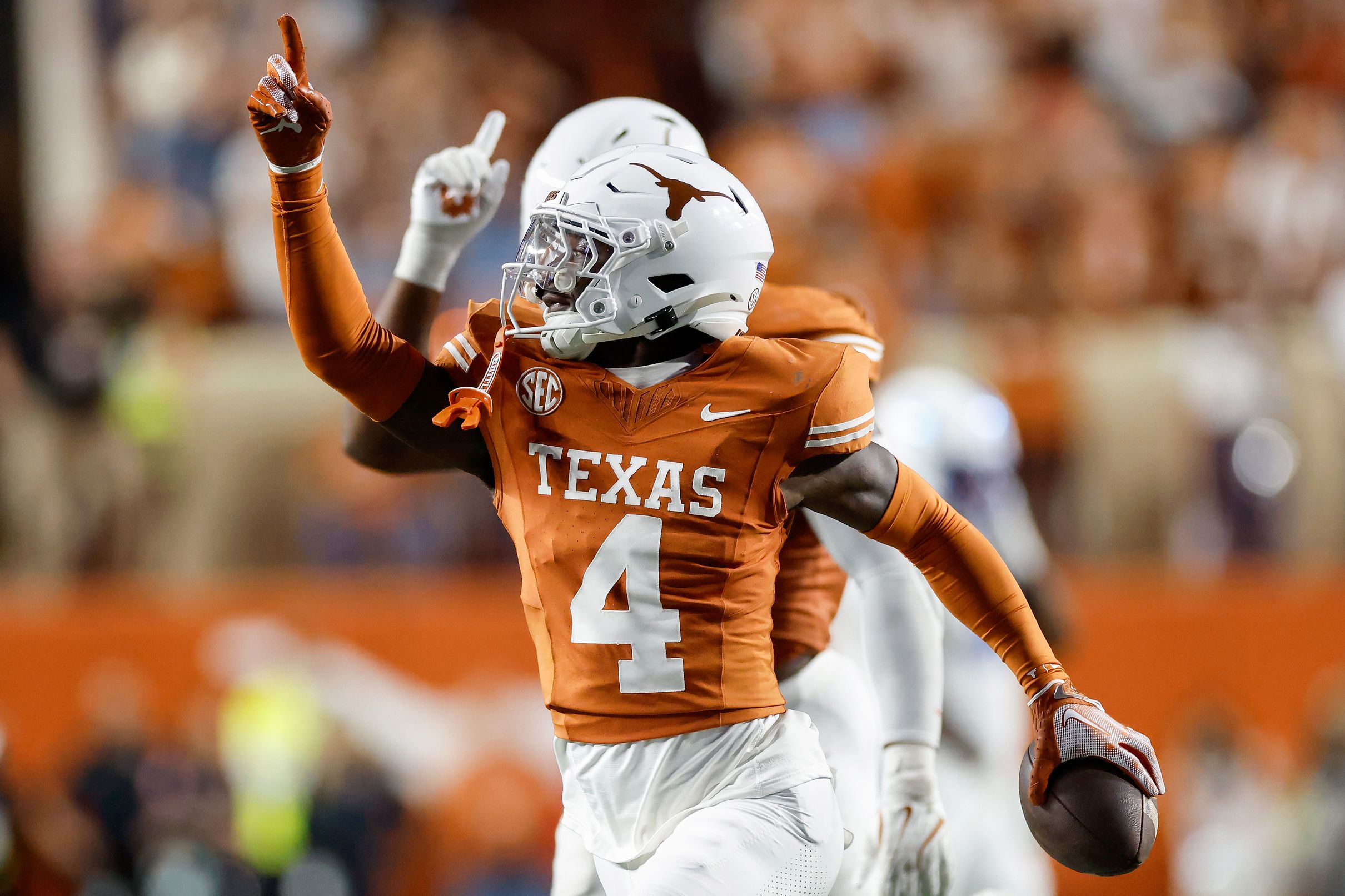 Andrew Mukuba celebrates an interception at Texas