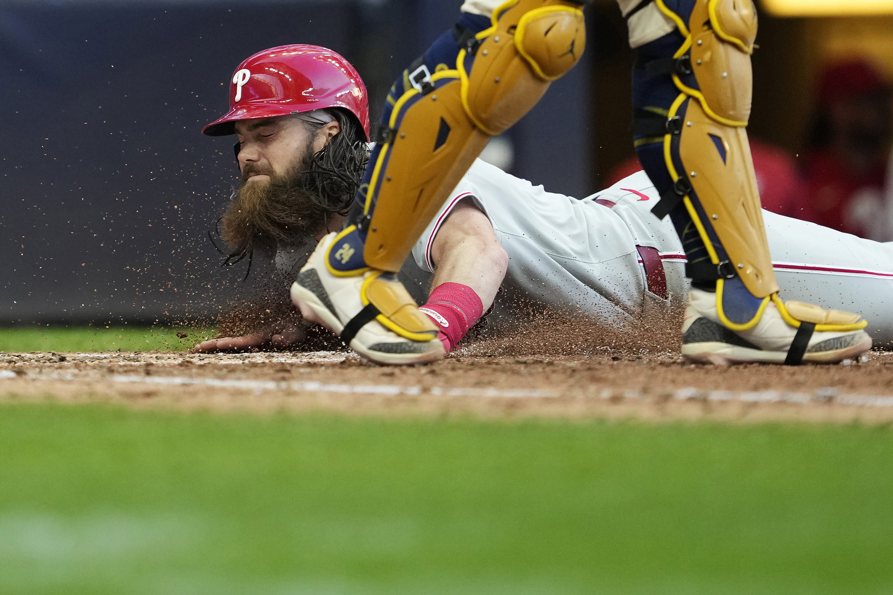 Brandon Marsh slides into home