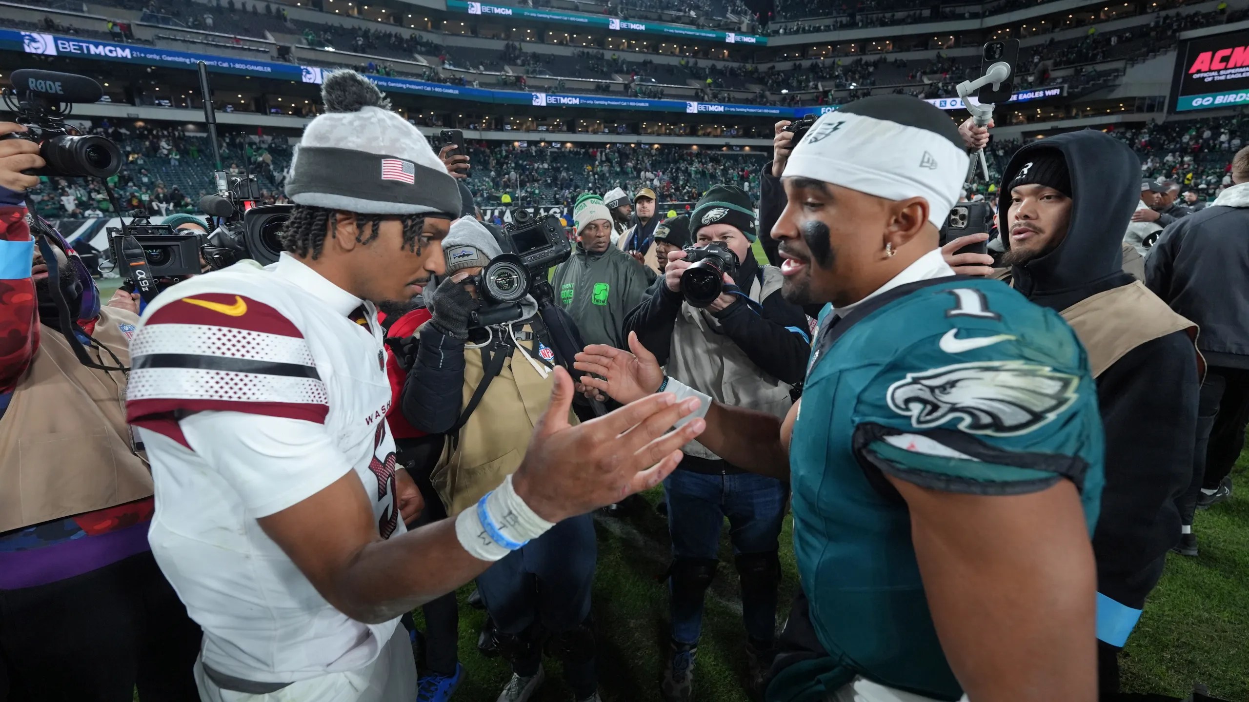 Jalen Hurts congratulating Jayden Daniels on getting beat in the NFC Championship game